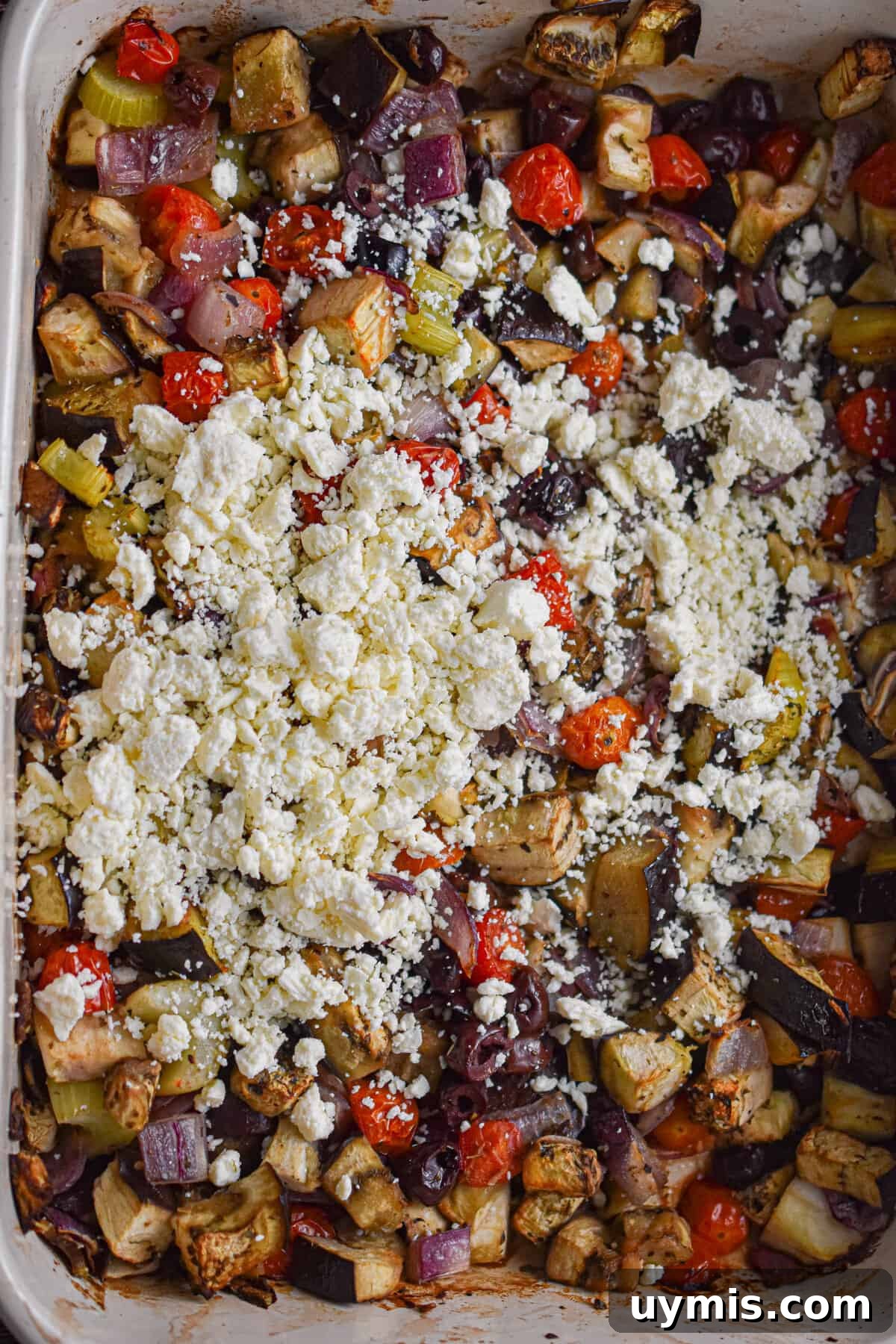 Creamy Greek Baked Pasta with Feta 8 The feta is added to the baking dish.