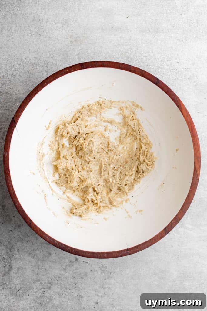 Homemade Caesar Salad Recipe with Classic Parmesan Dressing 5 Top down view of Caesar dressing in a mixing bowl.