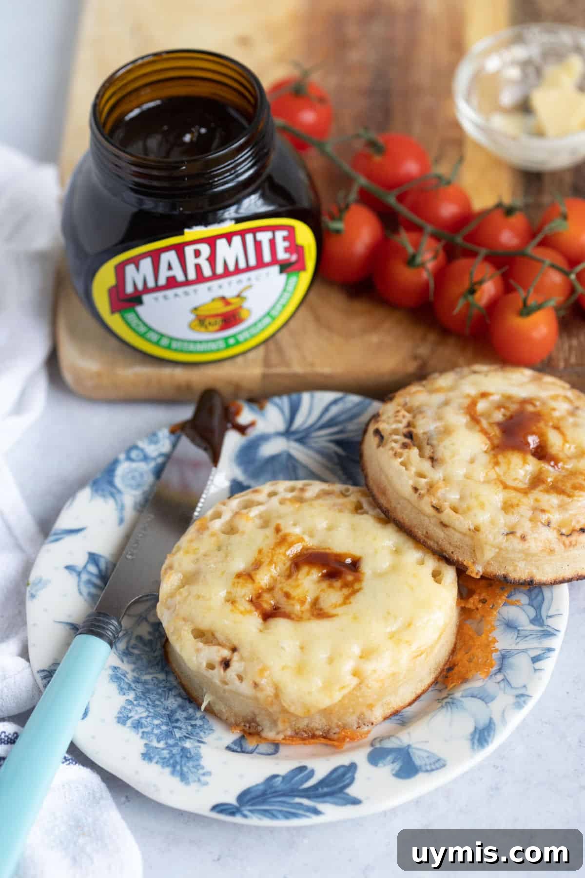 Cheesy air fryer crumpets on a blue plate.