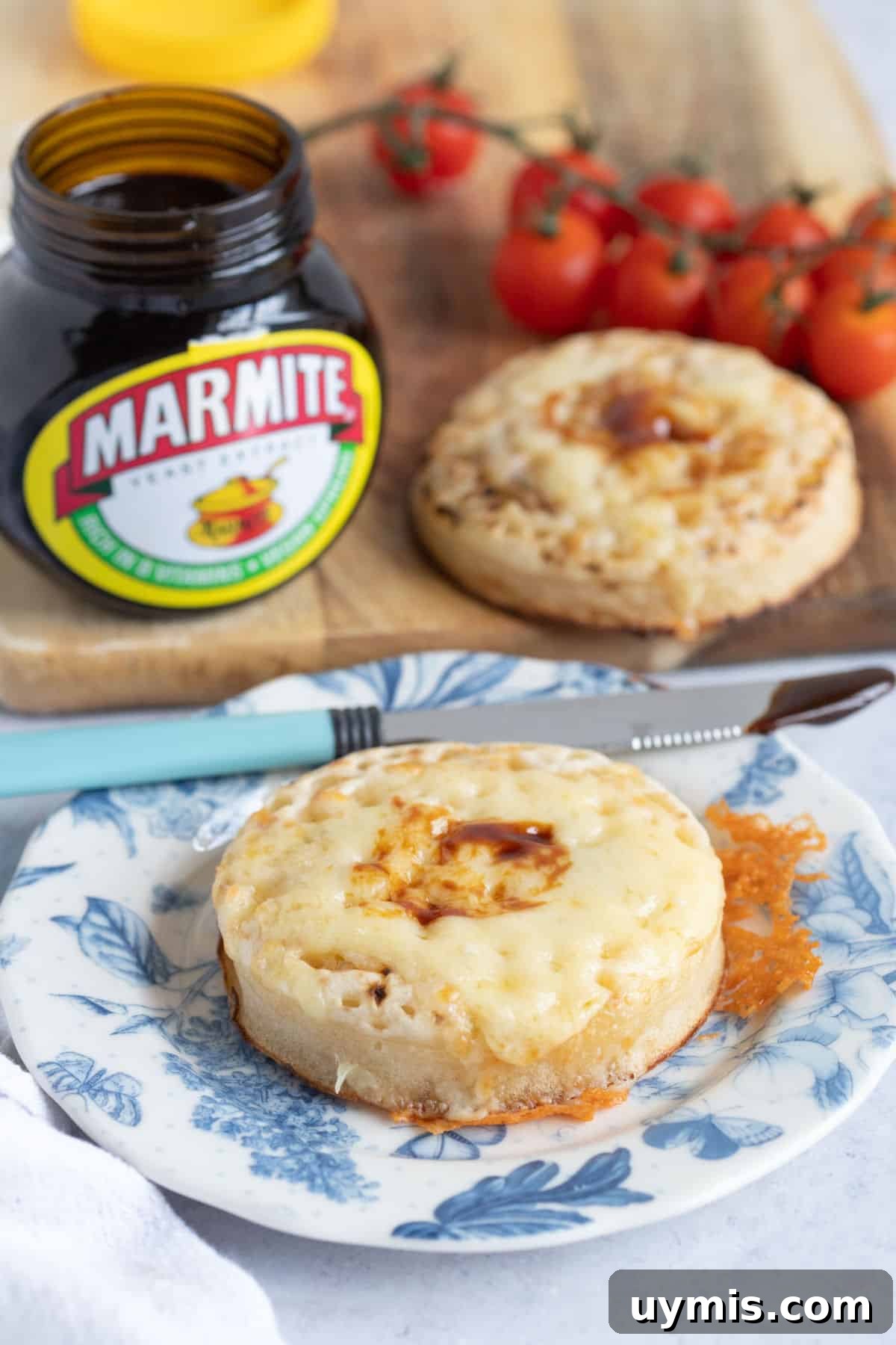 Air fryer crumpets with cheese on a blue plate.
