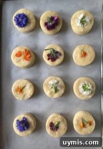 Lemon Cream Scones Recipe with Edible Flowers 6 Edible flowers being placed on scones