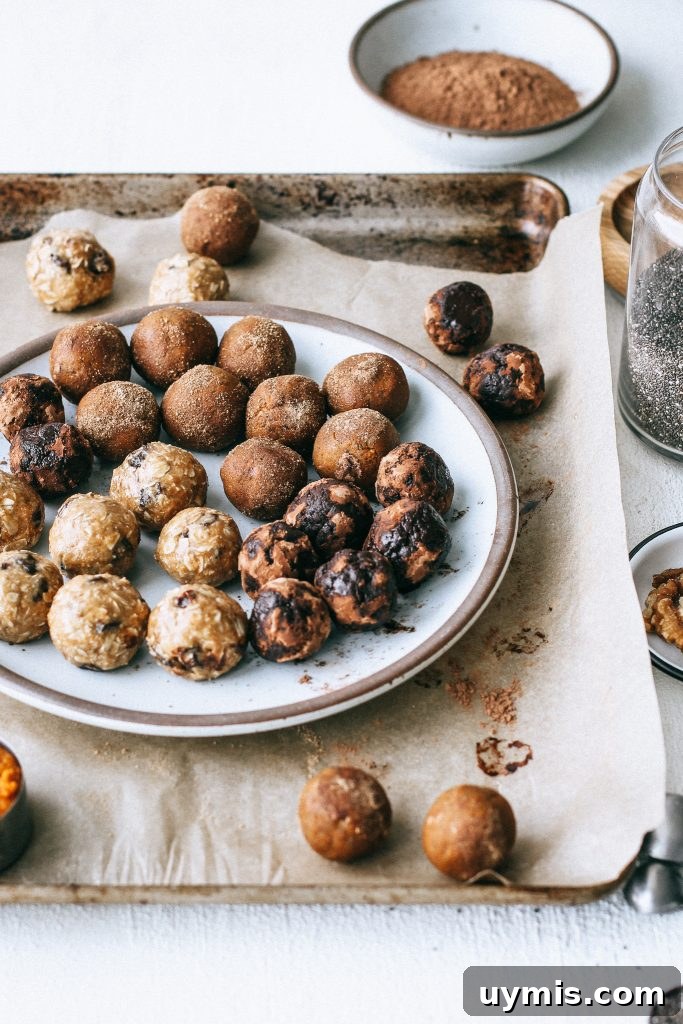Bliss Balls Recipe 3 Ways 3 raw energy balls on a plate on a baking tray