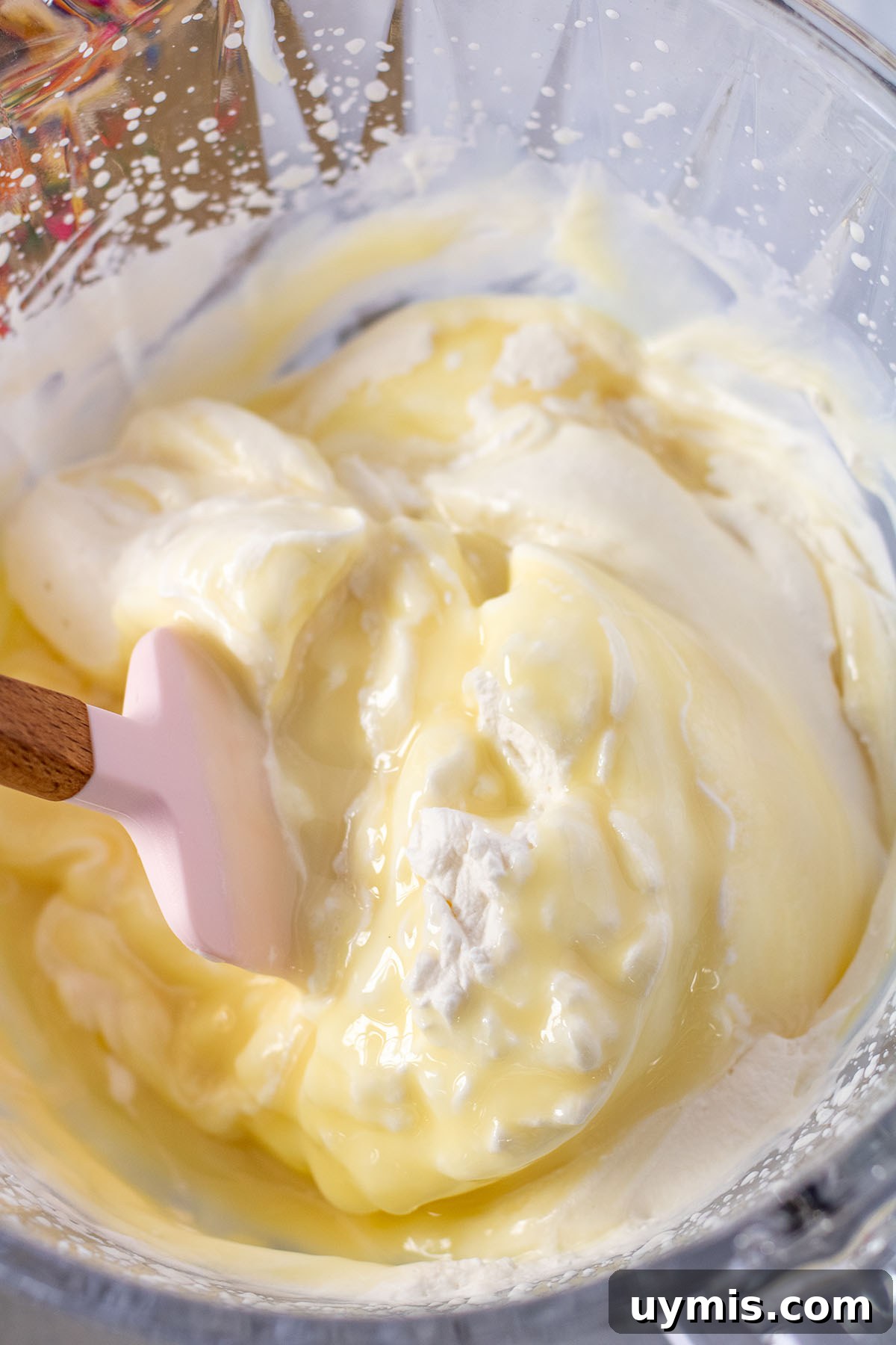 No-Churn Funfetti Golden Oreo Ice Cream Recipe 5 Sweetened condensed milk folded into whipped cream in the mixing bowl.