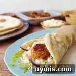 Vegetarian red lentil koftas with flatbreads and harissa yoghurt sauce