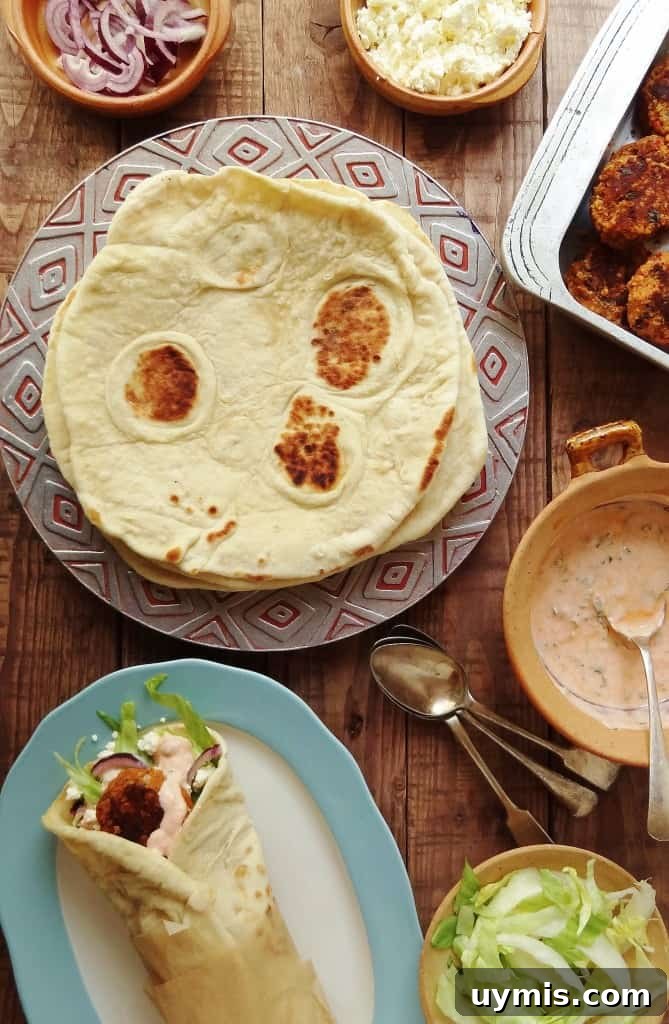 Red Lentil Koftas with Flatbread and Harissa Yogurt Sauce 8 Vegan red lentil and bulgur wheat koftas with flatbreads and harissa yoghurt
