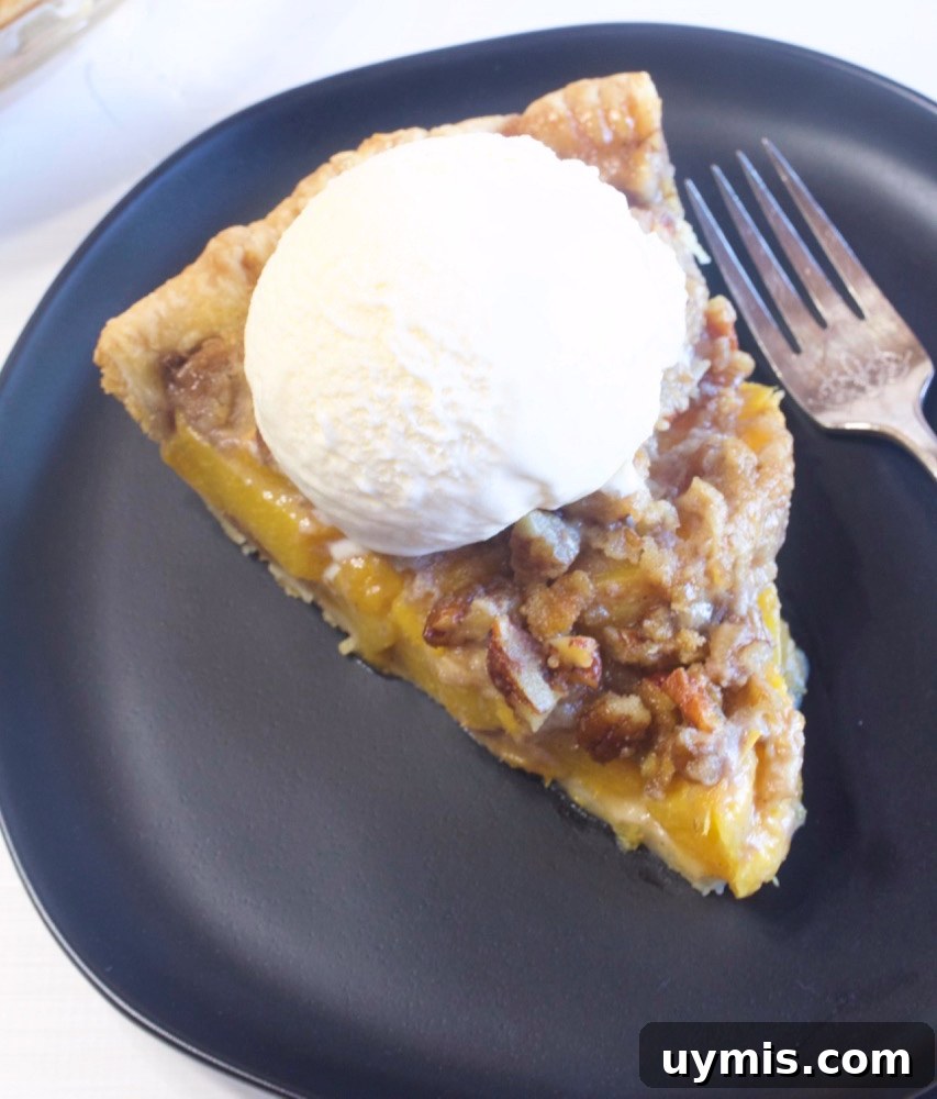 Brown Sugar Peach Crumble Pie Recipe 5 Homemade peach crumble pie with golden topping.