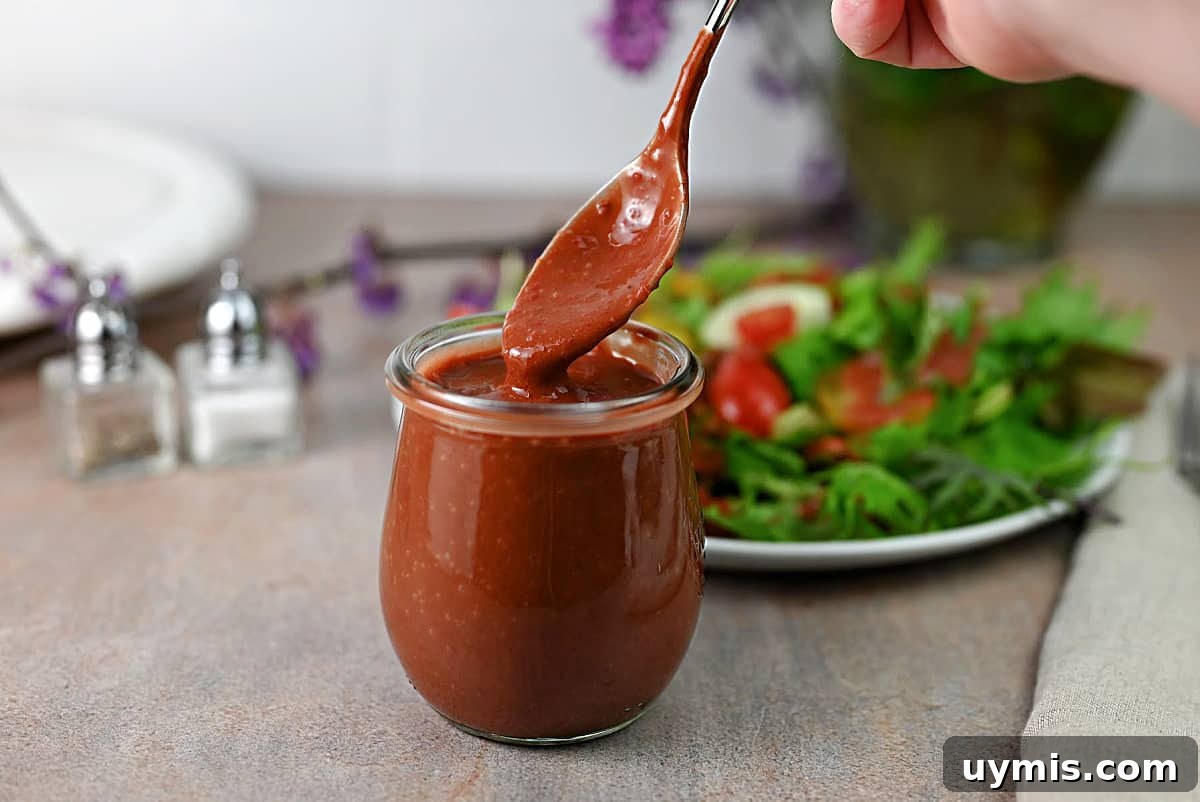 Homemade Strawberry Balsamic Vinaigrette Recipe 2 A small jar of strawberry vinaigrette dressing.