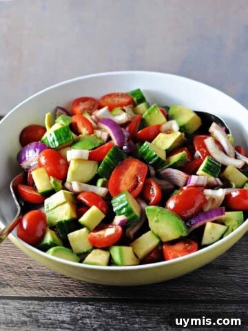 Balsamic cucumber tomato salad in a serving bowl