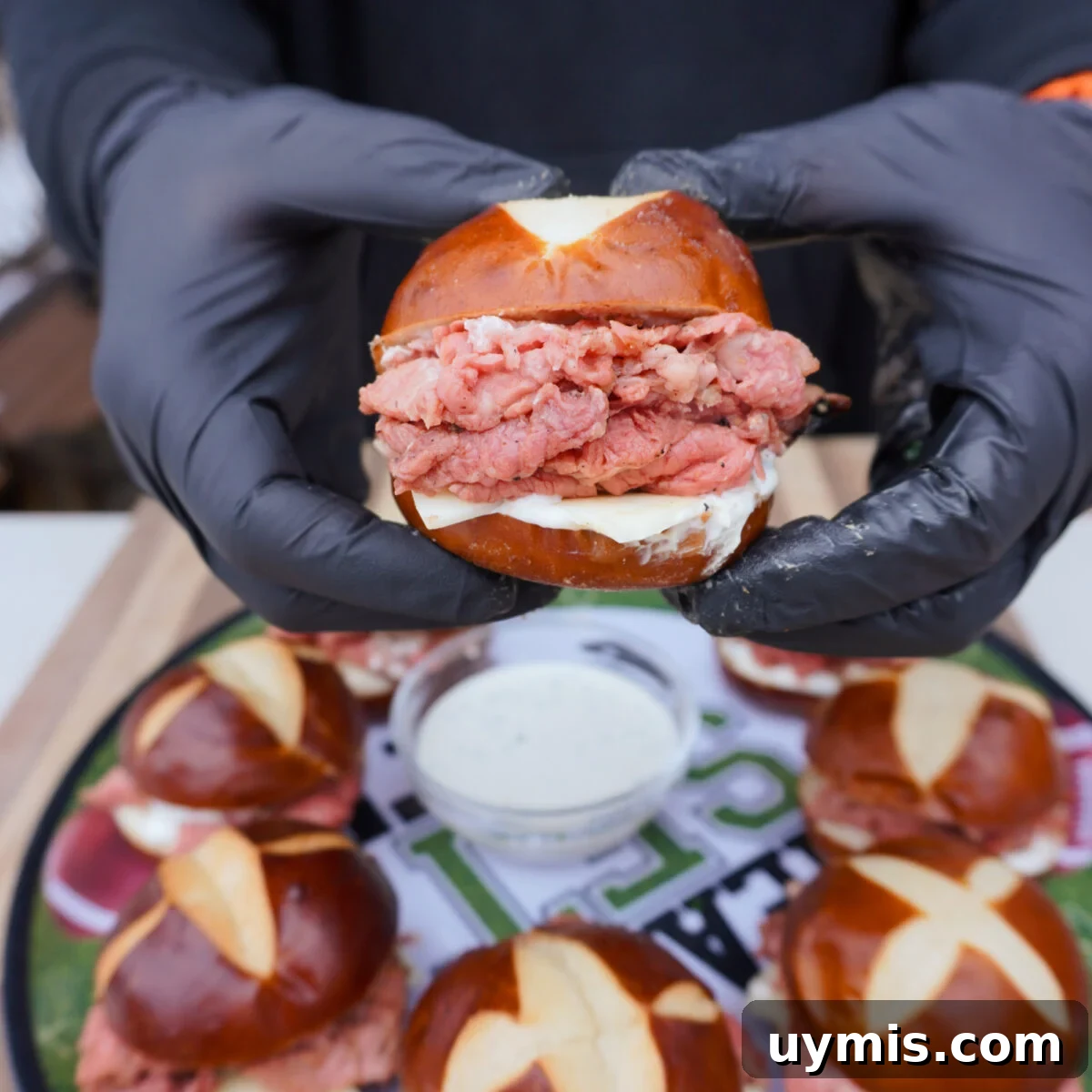 Grilled Prime Rib Sliders with Horseradish Sauce 2 grilled prime rib sliders presented.