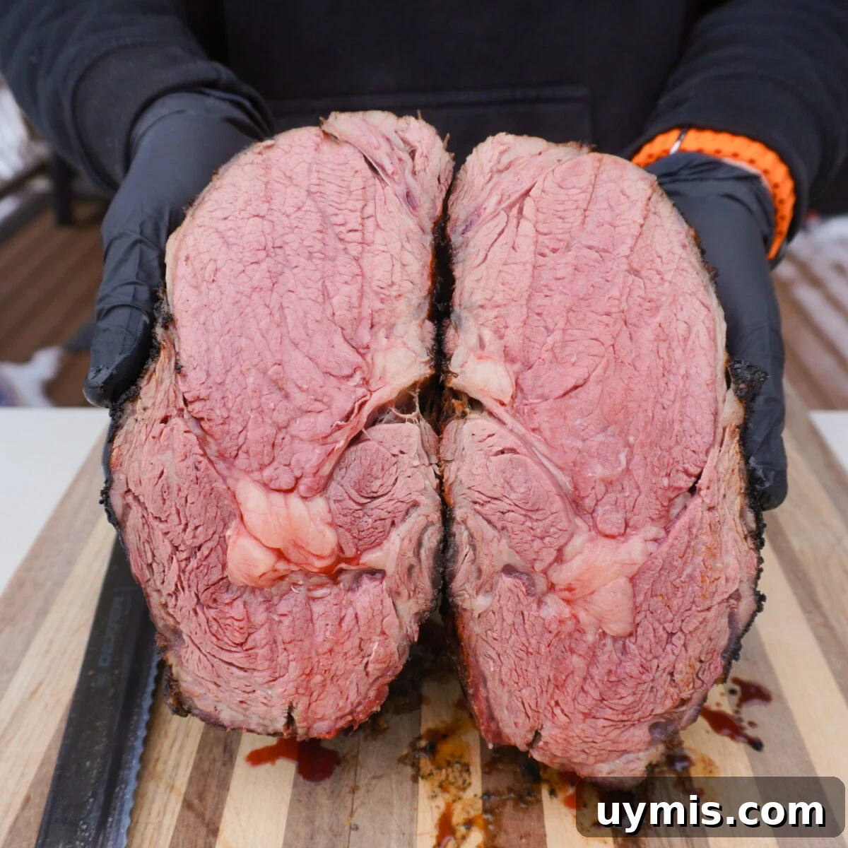 Grilled Prime Rib Sliders with Horseradish Sauce 8 Grilled and seared prime rib sliced in half showing a medium rare cook inside.