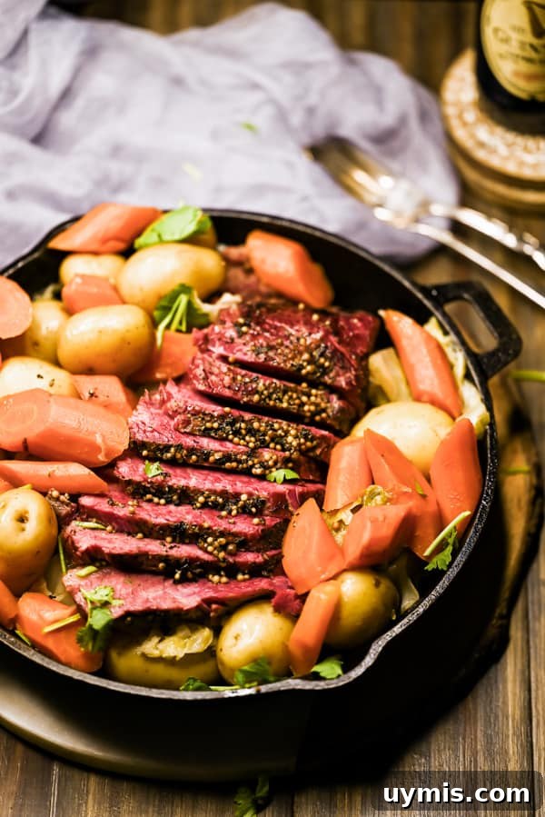 How to Make Tender Instant Pot Corned Beef 6 Instant Pot Corned Beef sliced in a serving dish.