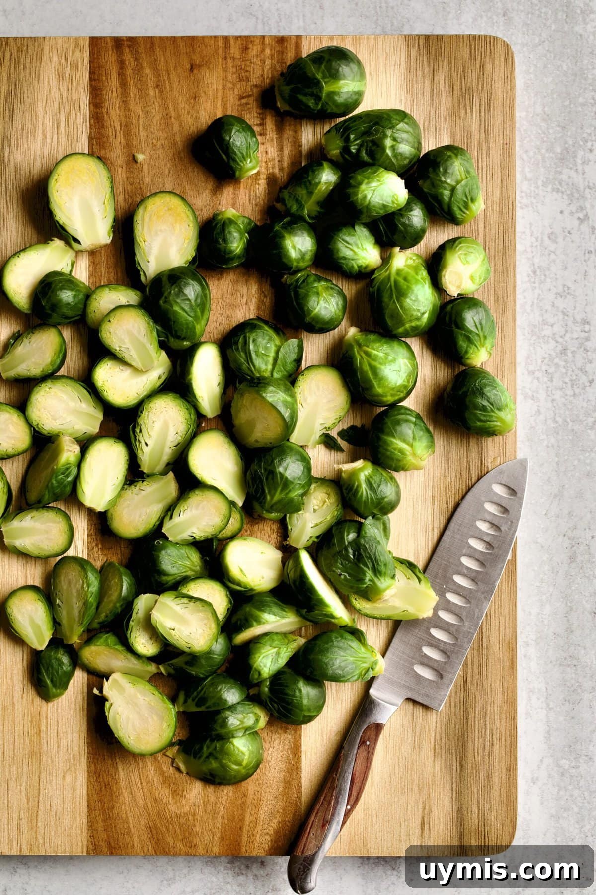 LongHorn Steakhouse Copycat Crispy Brussels Sprouts Recipe 7 cutting Brussels sprouts in half.