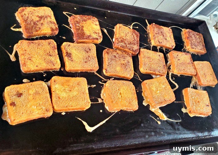 Crispy Golden French Toast on a Blackstone Griddle 3 French Toast cooking on Blackstone Griddle