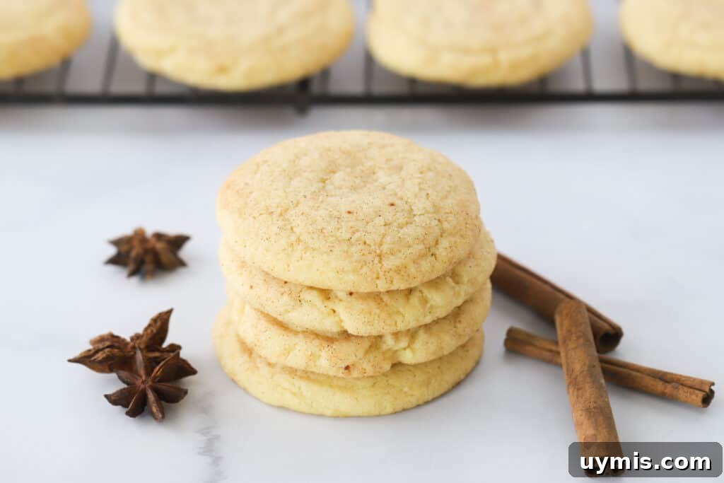 Fall Spice Snickerdoodle Cookies with Cinnamon Sugar 6 A stack of snickerdoodle cookies on a table with cinnamon sticks and star anise.