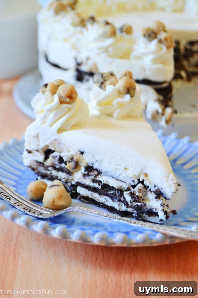 No-Bake Oreo Icebox Cake with Chocolate Chip Cookie Dough 4 cookie dough oreo icebox cake on a blue and white plate with a fork