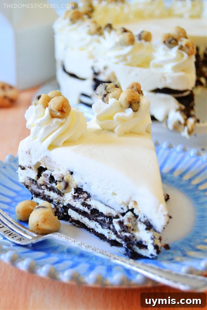 No-Bake Oreo Icebox Cake with Chocolate Chip Cookie Dough 6 closeup slice of cookie dough oreo icebox cake on blue plate with silver fork