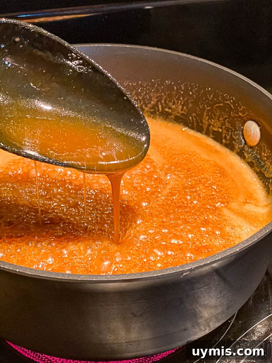 Honey-Glazed Ham Nuggets Recipe with Small Boneless Ham 6 Honey Glaze for Ham Nugget simmering in a pan on the stove