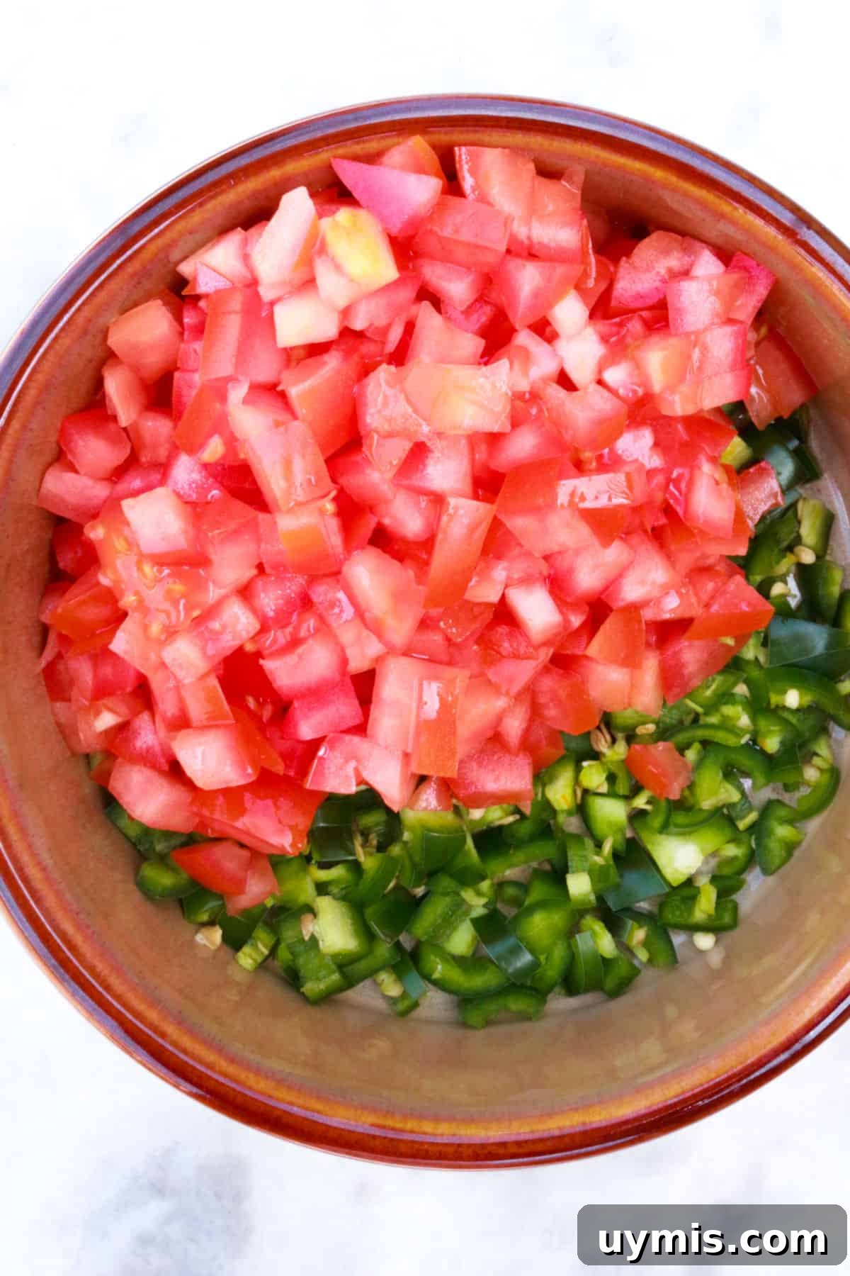 Fresh Salsa Bandera: Authentic Pico de Gallo Recipe 5 diced tomato and jalapeño in a bowl