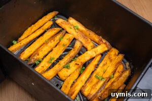 Crispy Air Fryer Sweet Potato Fries 14 Sweet Potato Fries in the Air Fryer sprinkled with chopped parsley