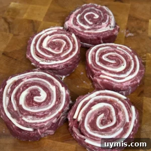 rolled up pinwheels on a cutting board