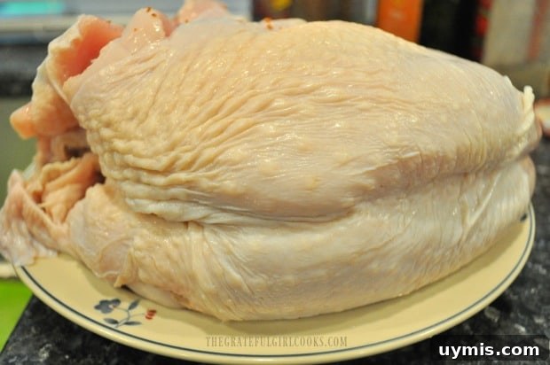 Preparing Turkey Breast For The Traeger A whole bone-in turkey breast is rinsed and patted dry before seasoning