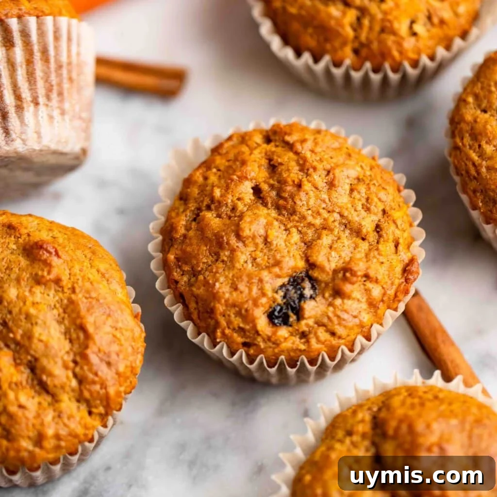 15 Proven Benefits of Carrots and Delicious Recipes 3 healthy carrot cake muffins on counter