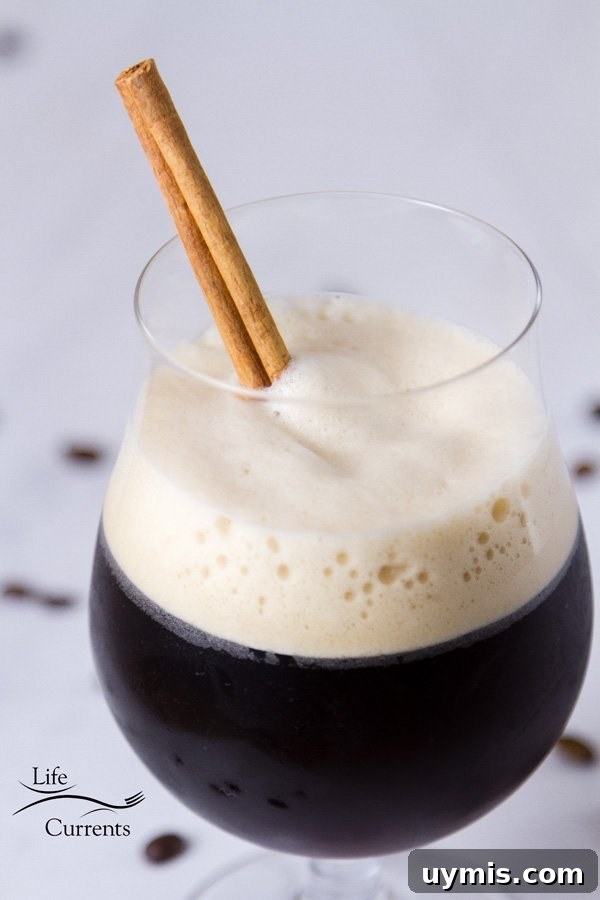 Iced shaken coffee with a foam head in a glass