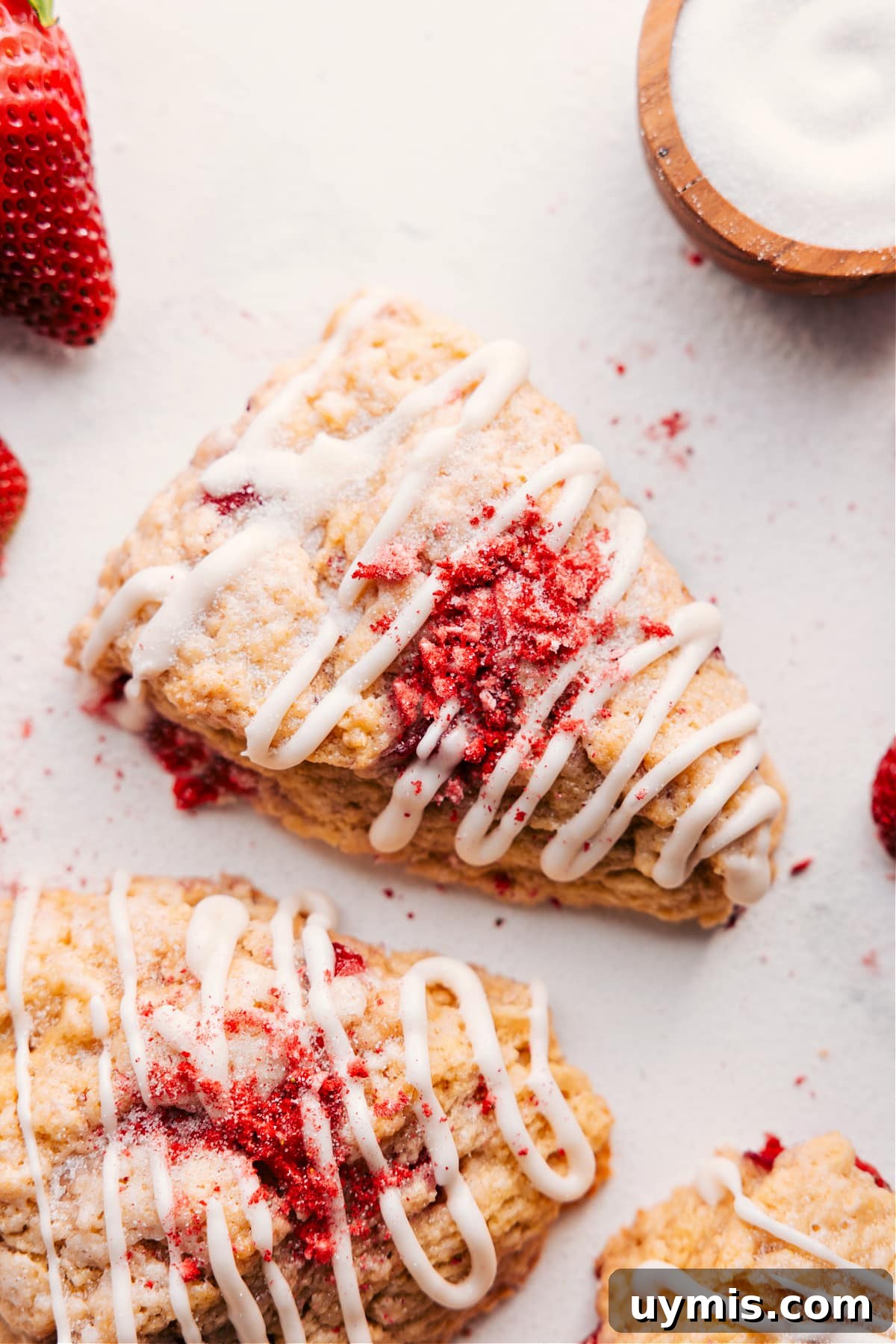 These Strawberry Scones Are The Perfect Way To Start Your Day Strawberry scones recipe topped with a sweet glaze and crushed strawberries.