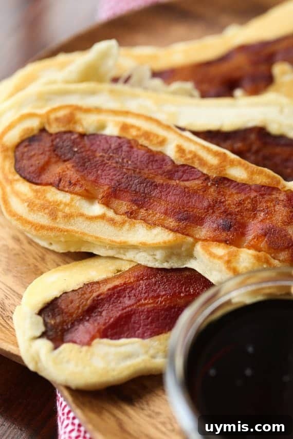 Maple Bacon Pancake Dippers Recipe 7 Pancake Bacon Dippers! A soft pancake surrounds a crispy piece of bacon that you can dip right in maple syrup!