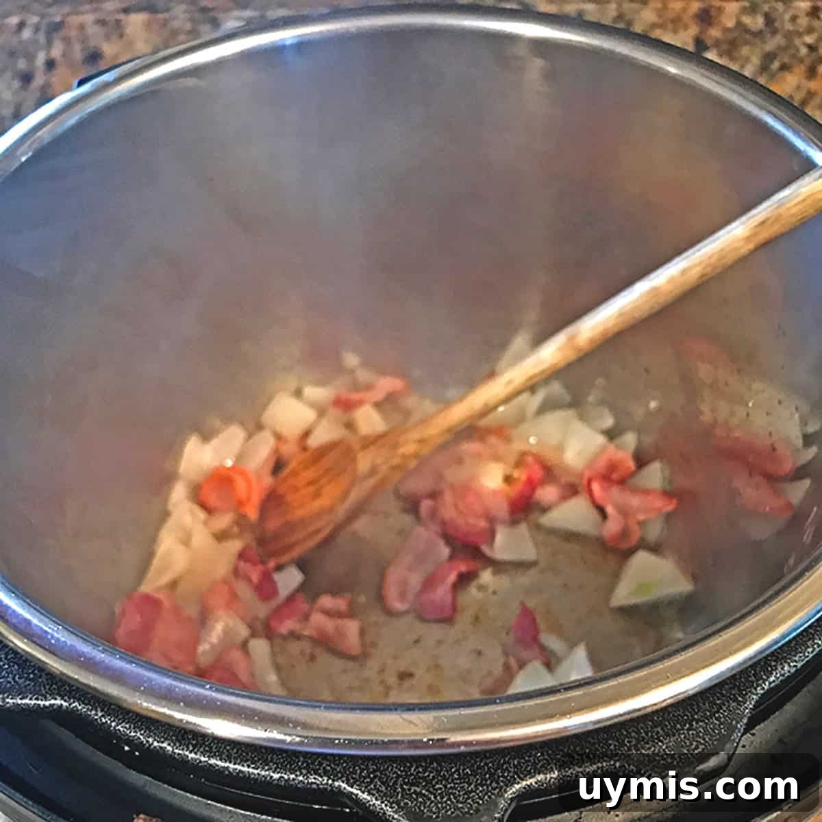 Sweet and Smoky Instant Pot Baked Beans 4 Sauteing onions and bacon in an instant pot.