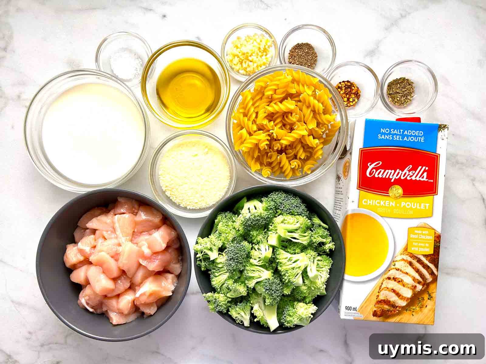 Creamy One Pot Chicken and Broccoli Pasta 3 ingredients prepped in bowls.