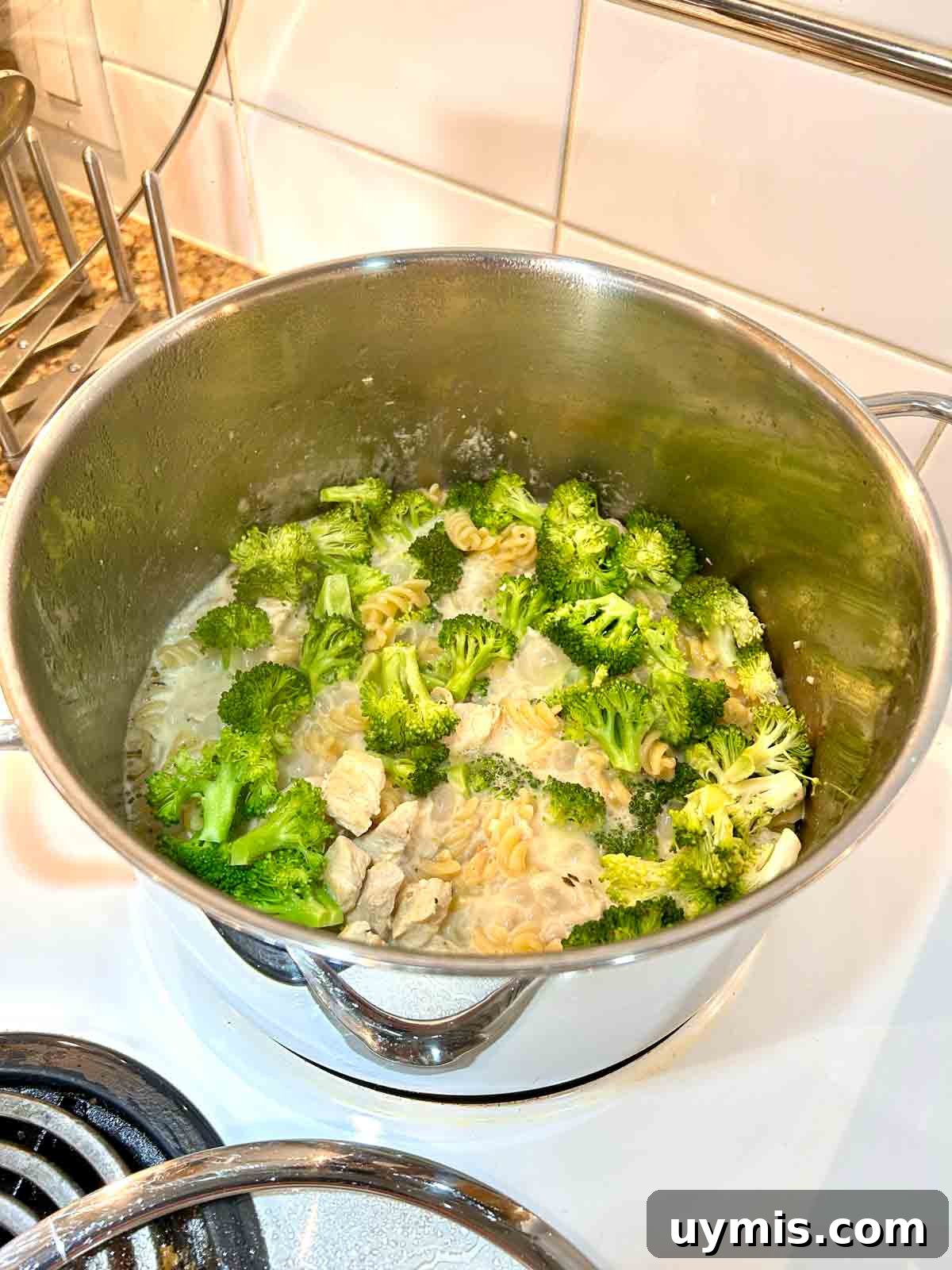 Creamy One Pot Chicken and Broccoli Pasta 6 broccoli florets added to the pot.