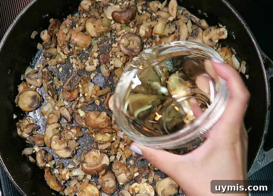 Creamy Ground Beef Stroganoff with Greek Yogurt 9 White wine added to the stroganoff sauce