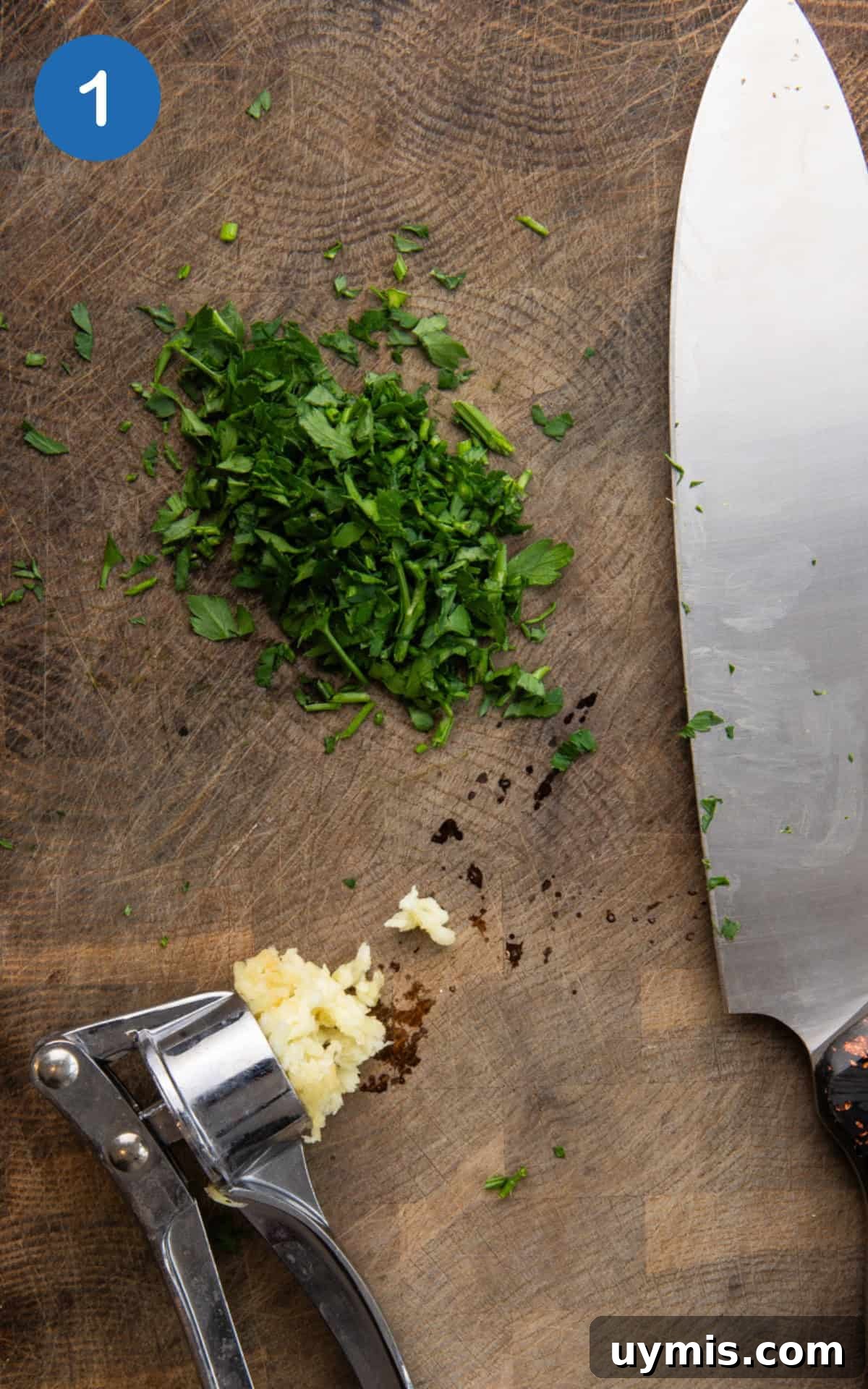 Air Fryer Corn on the Cob Recipe — Juicy and Crispy 4 chopped parsley and garlic on a wooden cutting board.
