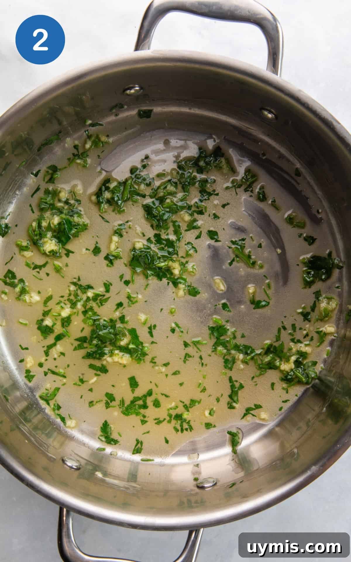 Air Fryer Corn on the Cob Recipe — Juicy and Crispy 5 melted butter, garlic, and parsley in a pan.