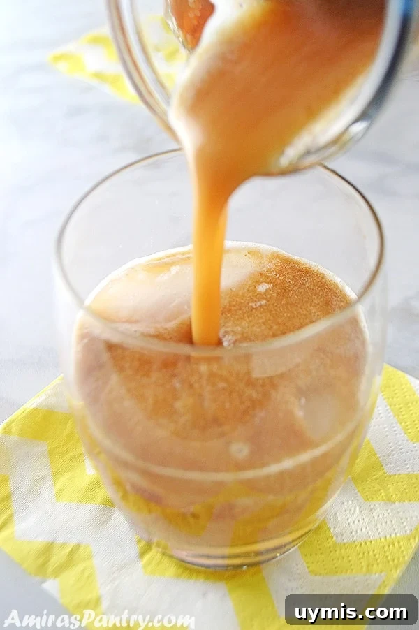 53-Recipe Meal Plan: Weekly Menus and Shopping List 12 A photo showing a glass of Tamarind juice is being poured