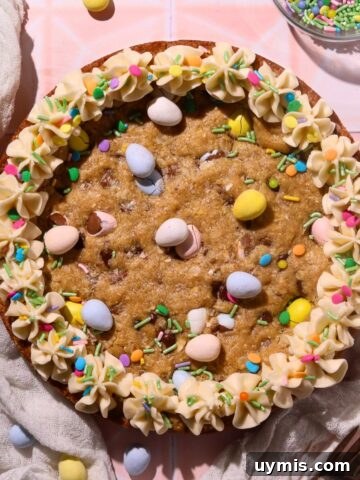 Easter cookie cake sitting on top of a pink tile surface.