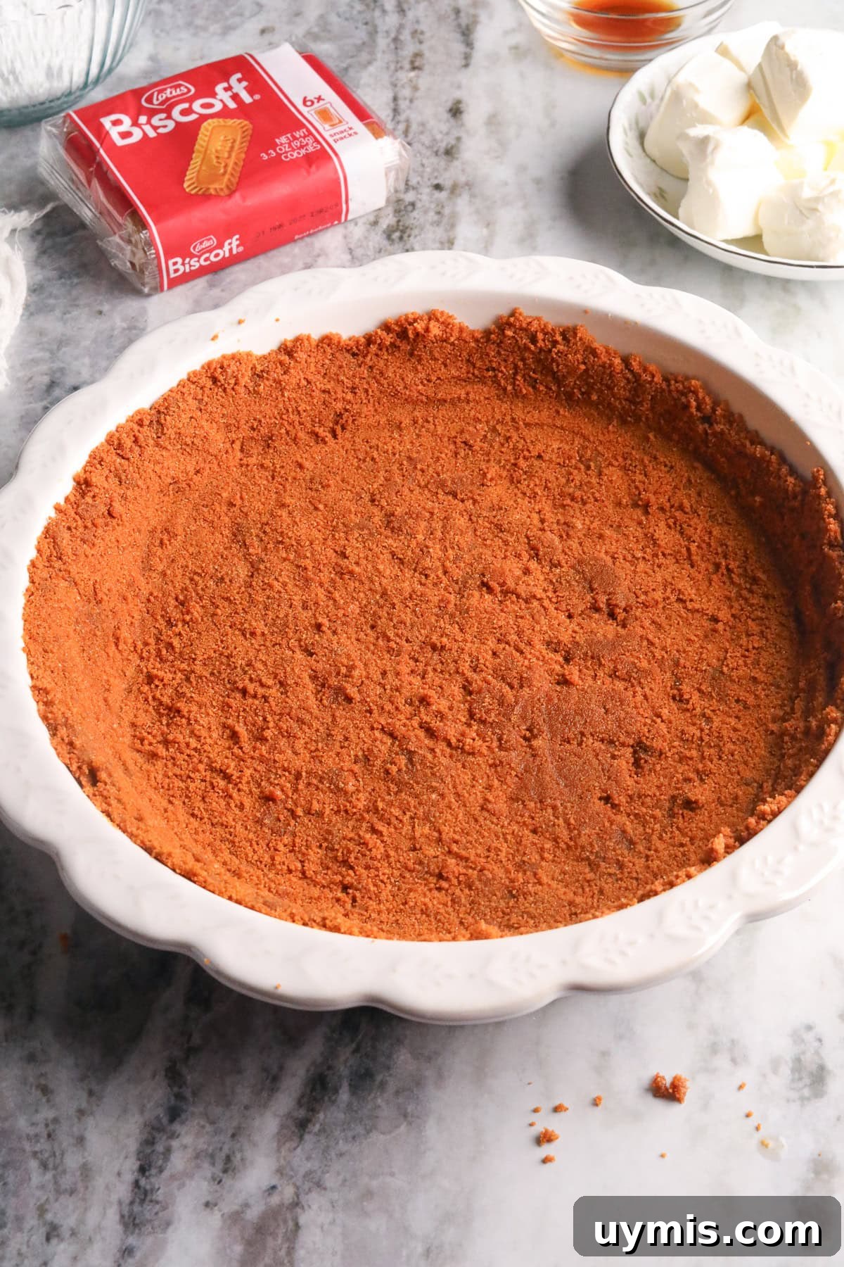 Creamy No-Bake Cookie Butter Pie Recipe 4 Cookie butter pie crust pressed into a glass pie dish.