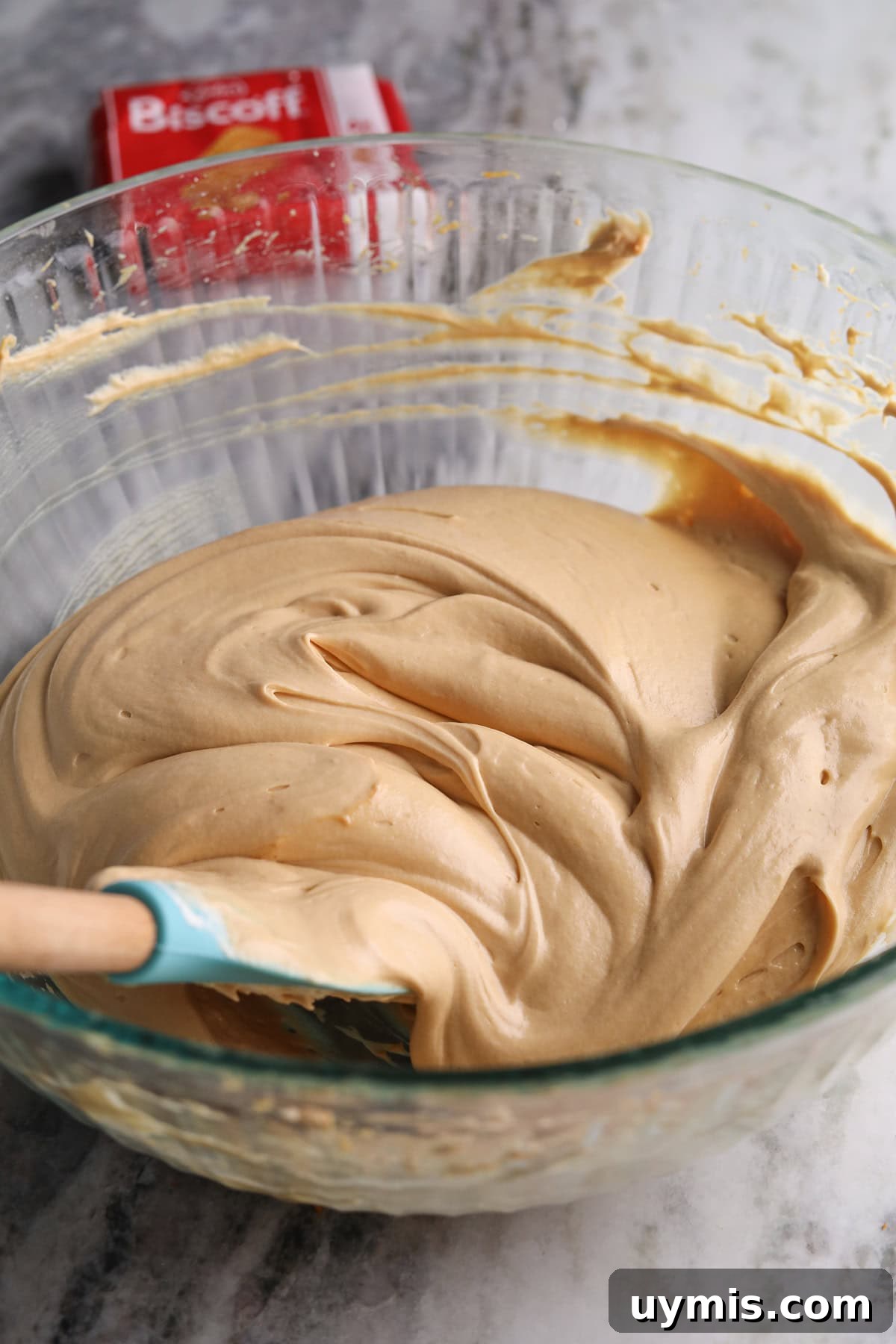 Creamy No-Bake Cookie Butter Pie Recipe 7 Cookie butter pie filling in a glass mixing bowl.