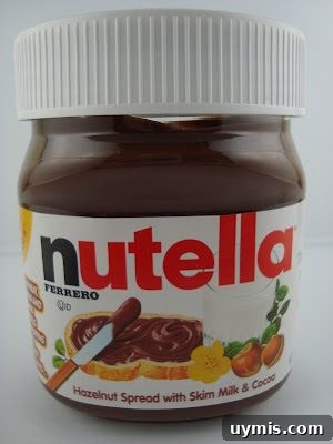 Nutella spread on a slice of bread with toppings
