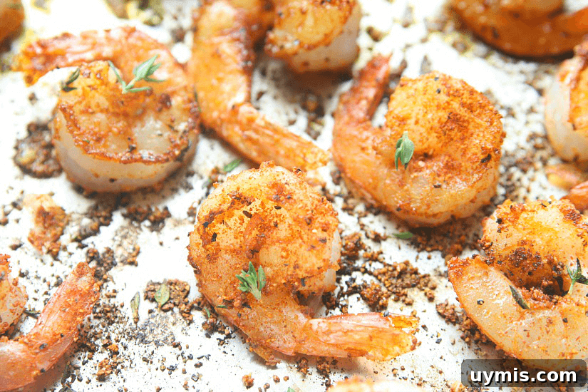 Blackened Shrimp and Cheese Ravioli Recipe 3 Shrimp in a pan with blackened seasonings.