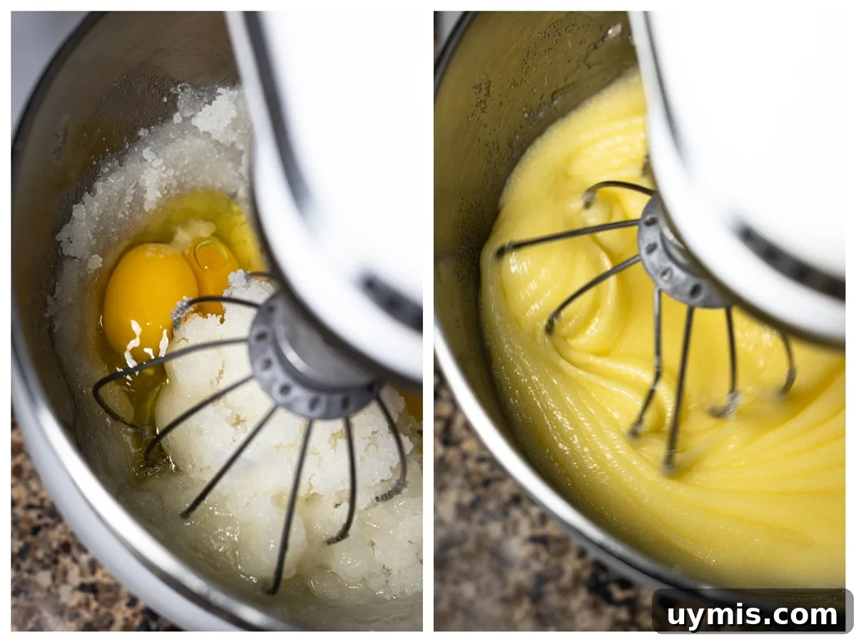 Standing mixer combining eggs with the oil and sugar mixture.