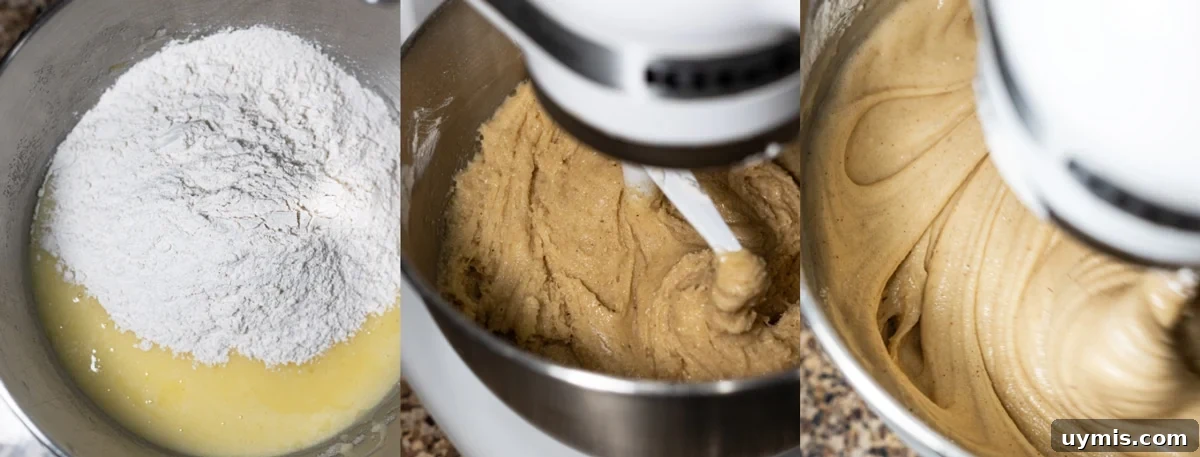 Standing mixer combining wet and dry ingredients for homemade bread.