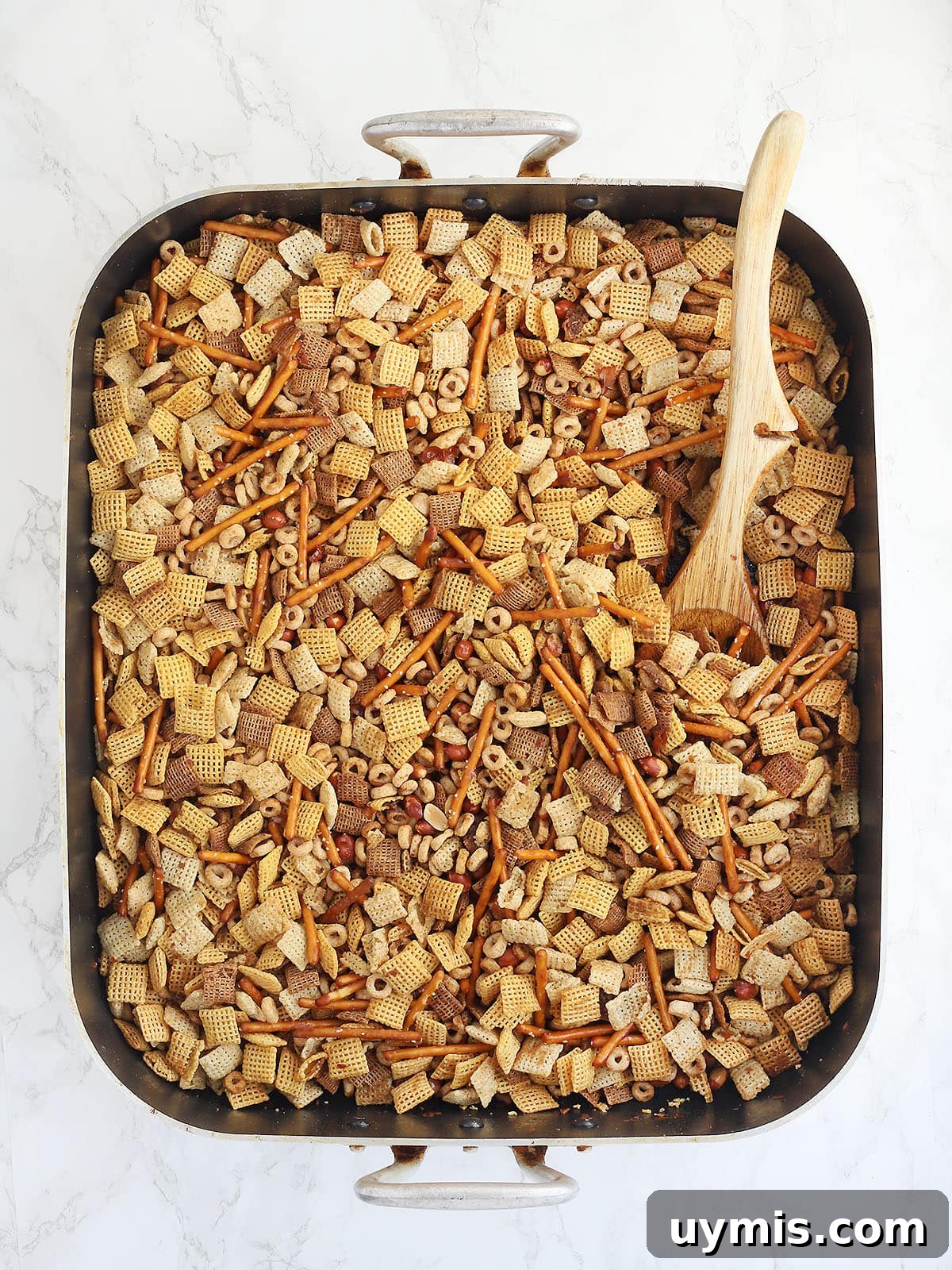 Crispy Oven Baked Chex Mix with Bacon Drippings 8 Chex mix ingredients in a large roasting pan.