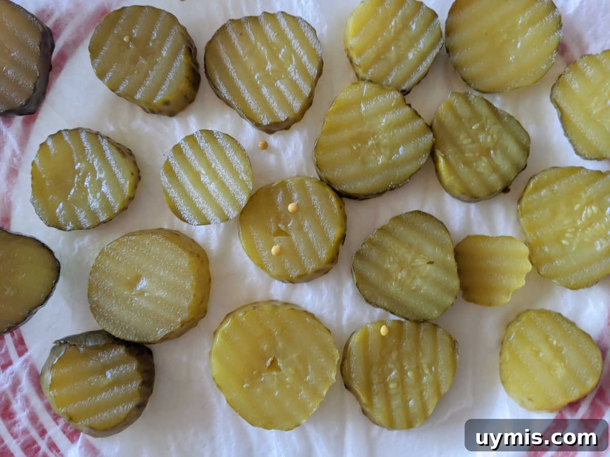 draining the bread and butter pickle slices