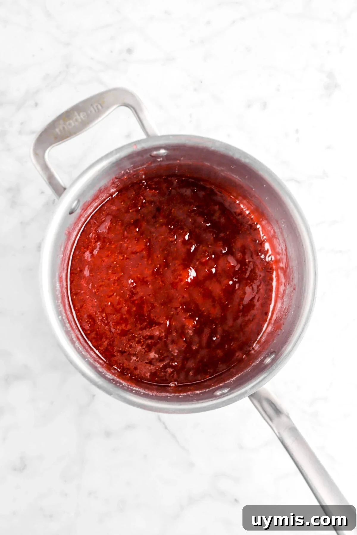strawberry jam in small pot.