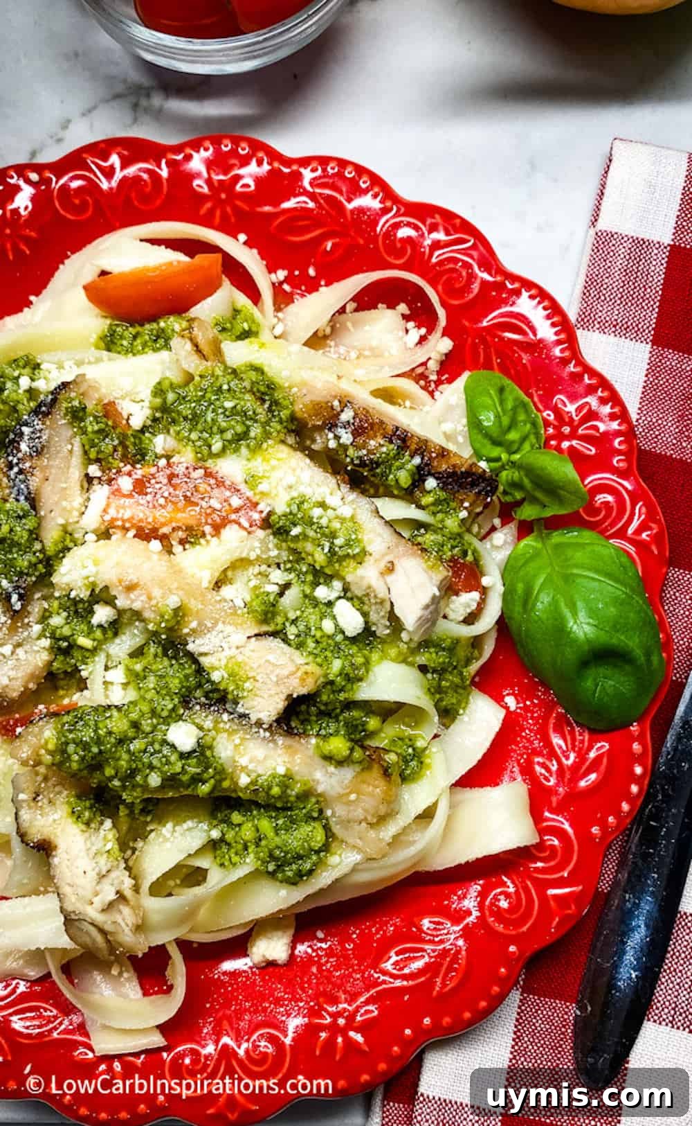 2 Ingredient Keto Pasta Recipe for Low Carb Noodles 12 Keto pasta noodles served on a red plate.