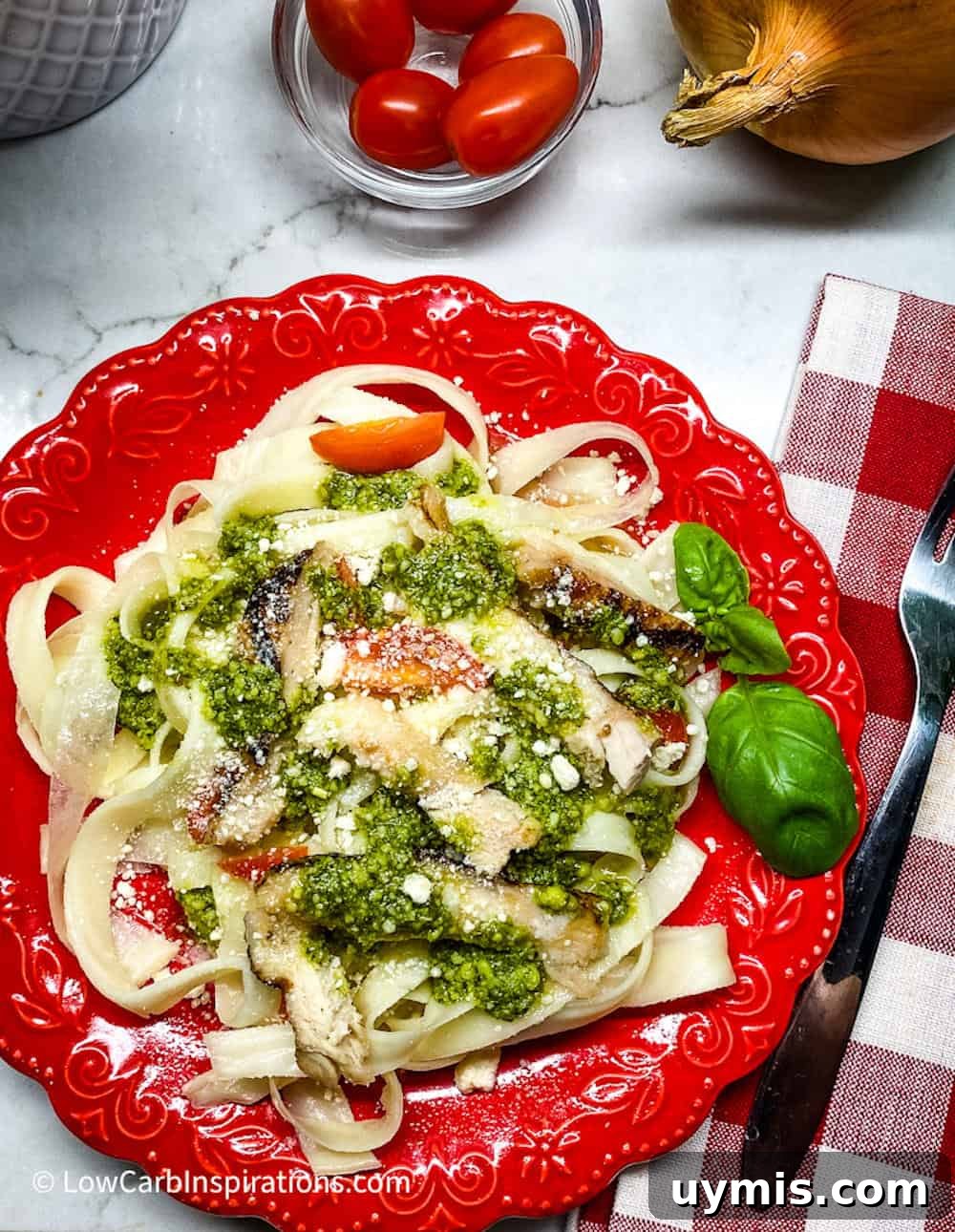 2 Ingredient Keto Pasta Recipe for Low Carb Noodles 3 Keto pasta served on a red plate includes a gingam red napkin