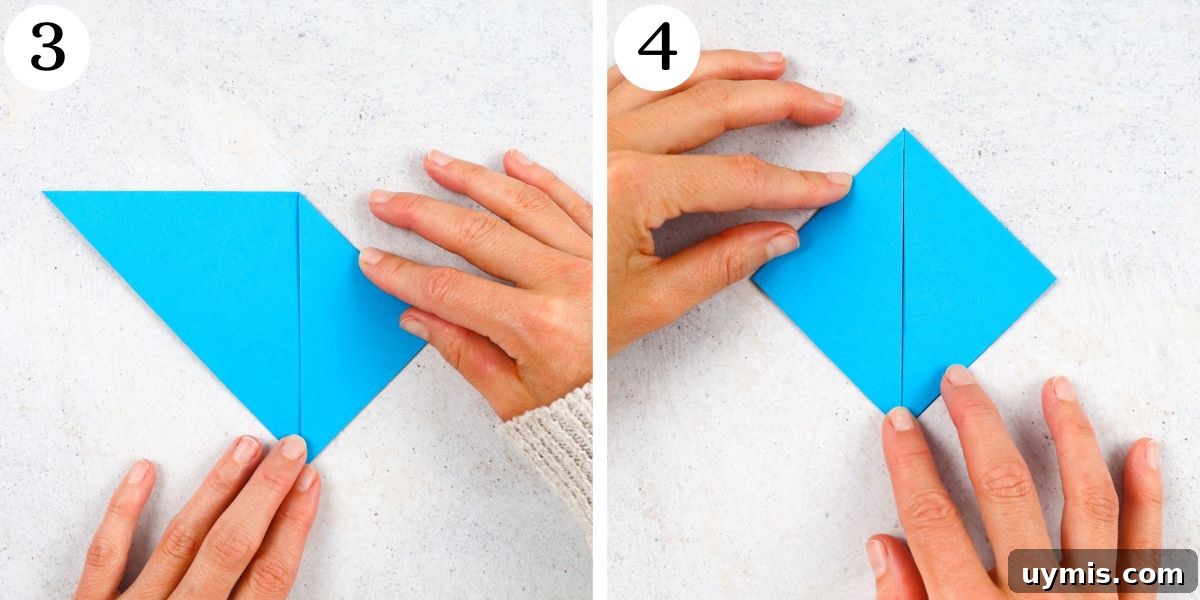 How to Make an Origami Corner Bookmark 5 Fold the right and left corner of your triangle to meet the bottom corner.