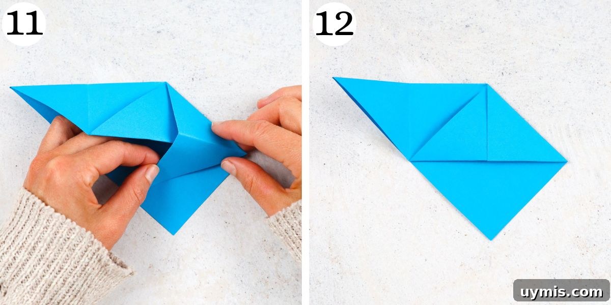 How to Make an Origami Corner Bookmark 9 Tuck it underneath the flap.